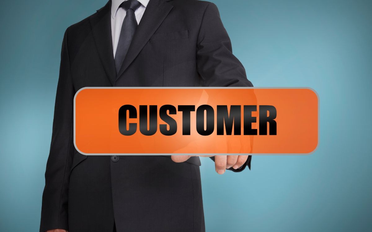 Businessperson selecting a customer button